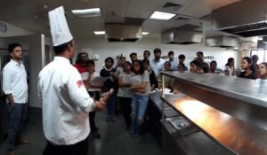 Faculty of SRIHM explaining working of a Kitchen & Restaurant to students of S.Y. B’Arch