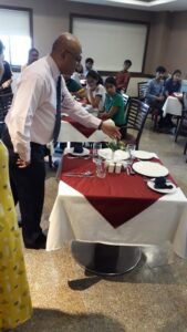 Faculty of SRIHM displaying the table etiquette to students of S.Y. B’Arch