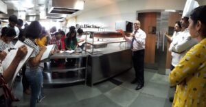 Faculty of SRIHM explaining working of a Kitchen & Restaurant to students of S.Y. B’Arch