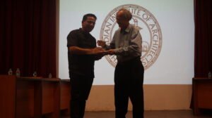 Prof. Ar. Yashwant Pitkar felicitating Ar. Mandar Parab, Principal L.S. Raheja School of Architecture.